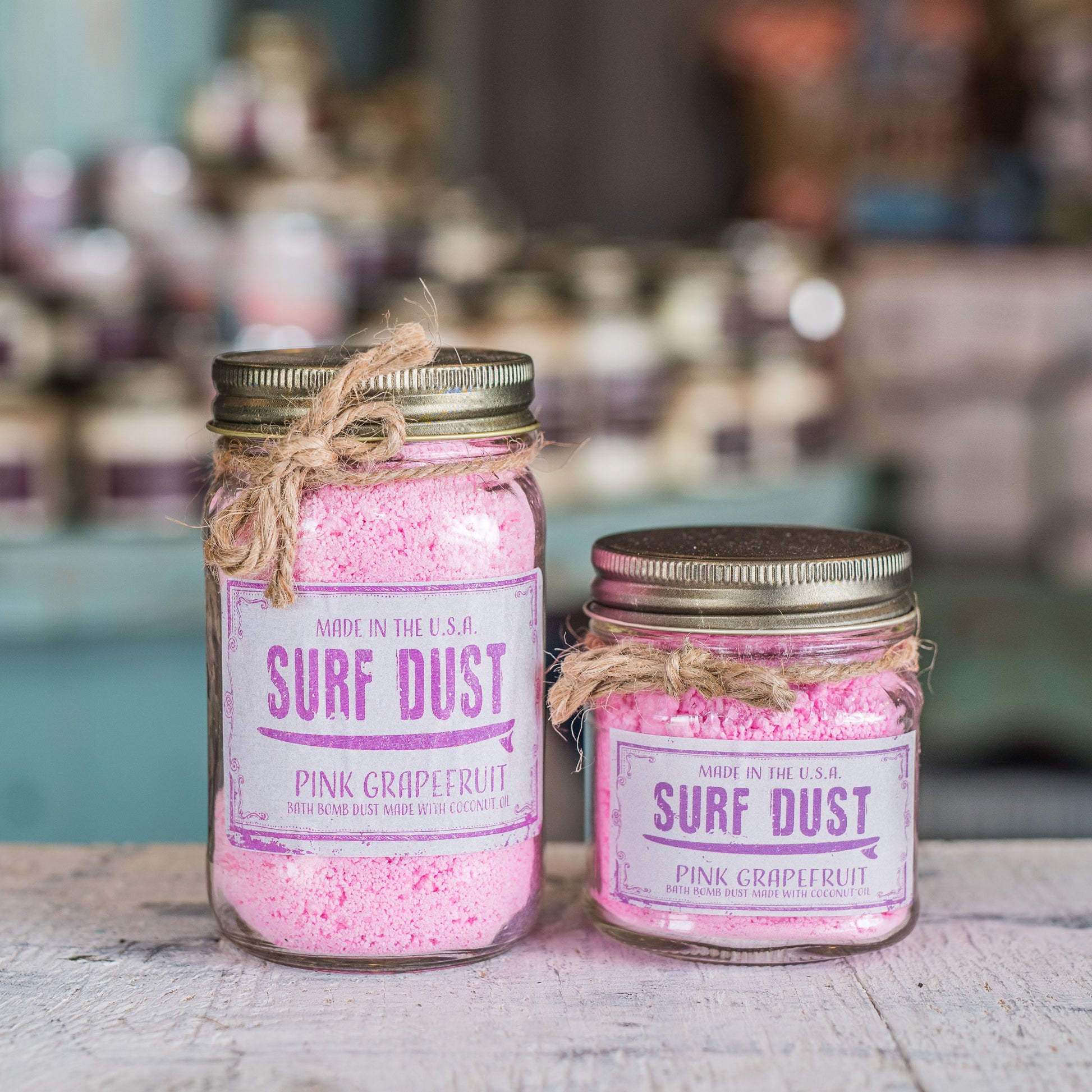 Surf Dust Pink grapefruit bath bomb in a jar